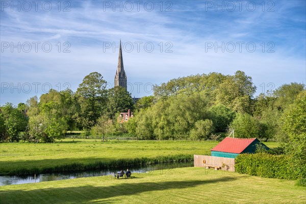 View over the parkland Queen Elizabeth Gardens to Salisbury Cathedral with the 123 m high and Britain's highest church tower