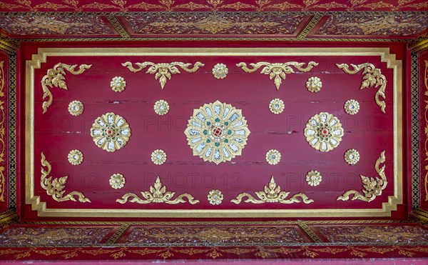 Red ceiling with golden floral ornaments in the Siamese Temple Sala-Thai I