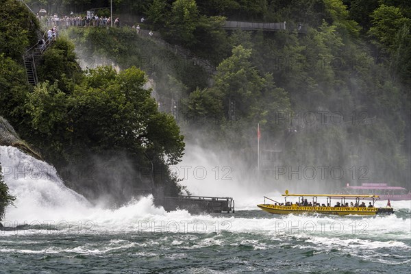 Excursion boat approaching the Rhine Falls waterfall near Neuhausen am Rheinfall