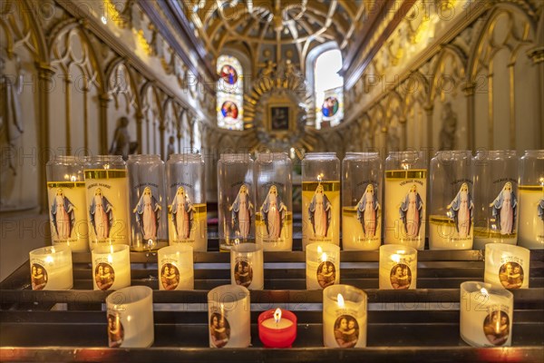 Sacrificial candles in a chapel of St John's Cathedral in Besancon