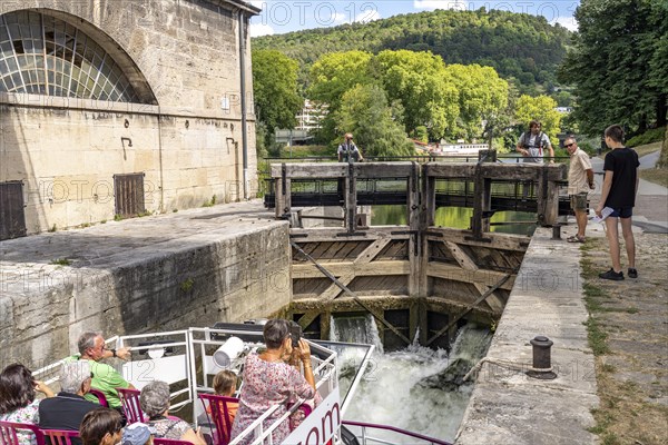 Excursion boat in a lock on the river Doubs