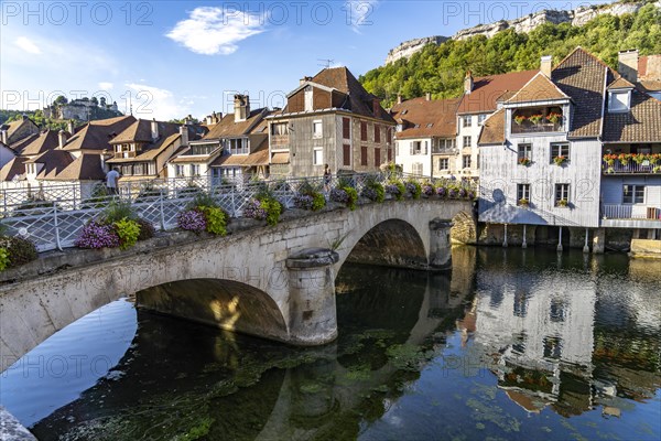 Houses of the old town and the Grand Pont bridge on the river Loue in Ornans