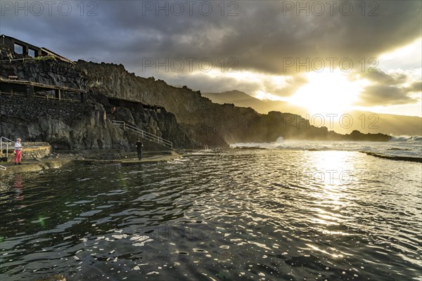 Sunset at the natural swimming pool La Maceta