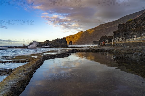 Sunset at the natural swimming pool La Maceta