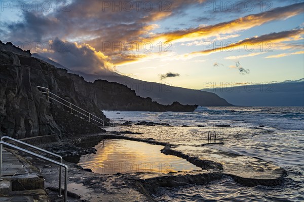 Sunset at the natural swimming pool La Maceta