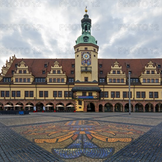 Leipzig market with city coat of arms on the pavement in front of the Old Town Hall