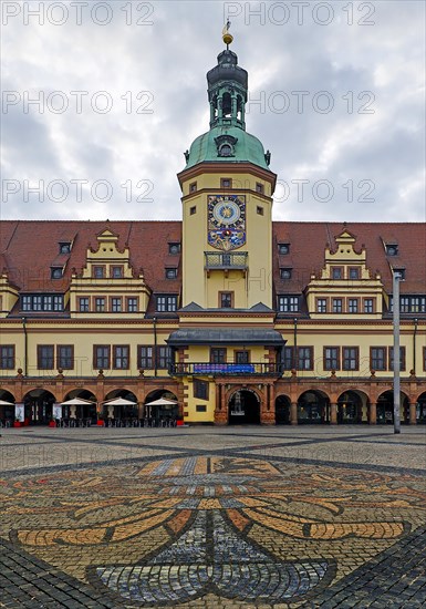 Leipzig market with city coat of arms on the pavement in front of the Old Town Hall