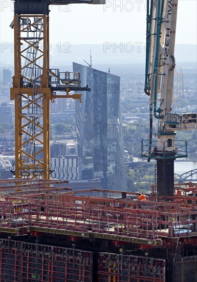 Large construction site with the project name Four Frankfurt with a view of the European Central Bank ECB