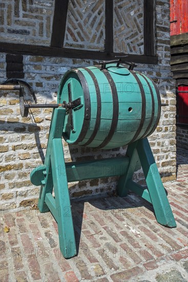 Old vintage wooden barrel-type butter churn