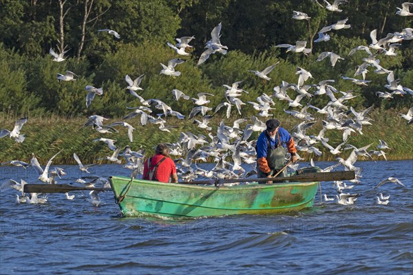 Two fishermen in rowboat