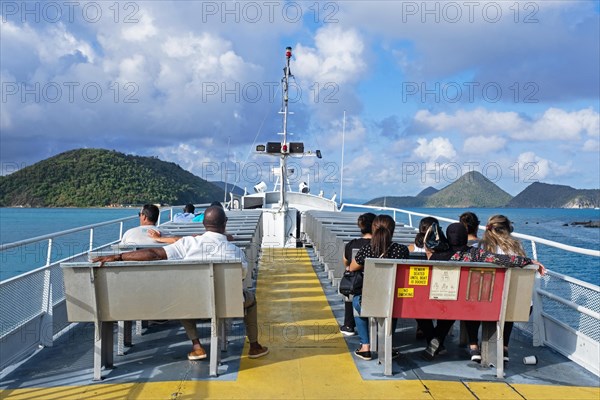 Tourists on ferry boat sailing from the island Tortola to Saint Thomas