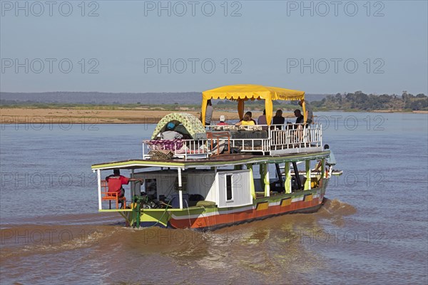 Tourists on a motorboat trip on the Tsiribihina