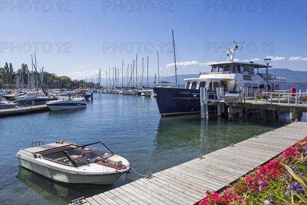 CGN passenger ferry boat Lavaux and sailing boats in the marina at Yvoire along Lake Geneva