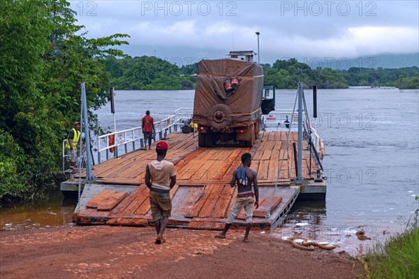 Truck on ferry boat crossing the Essequibo river in the rainy season along the Linden-Lethem dirt road