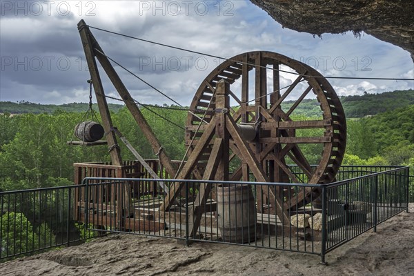 Medieval treadwheel crane at the fortified troglodyte town La Roque Saint-Christophe