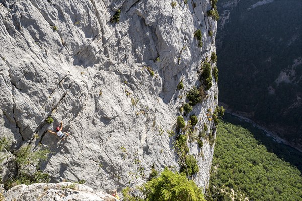 Rock climber climbing rock face in the Gorges du Verdon