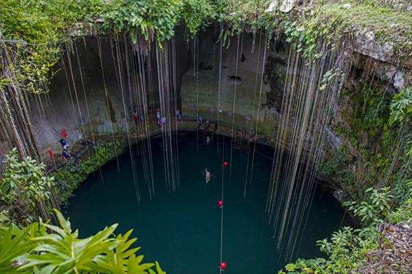 Tourists swimming in the Ik Kil Cenote