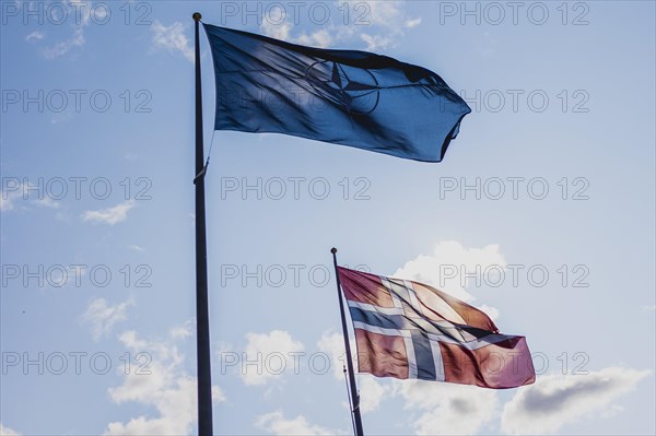 The flag of NATO and Norway