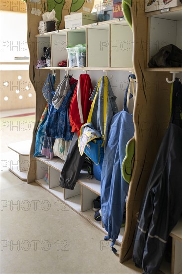 Jackets and shoes at a cloakroom in a kindergarten