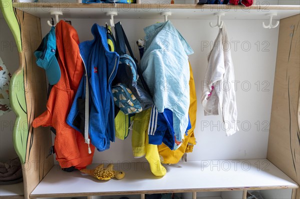 Jackets and shoes at a cloakroom in a kindergarten