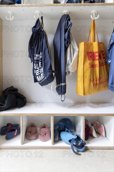 Jackets and shoes at a cloakroom in a kindergarten