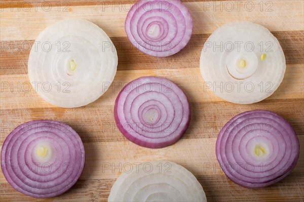 Sliced onion rings and onion slices on the background