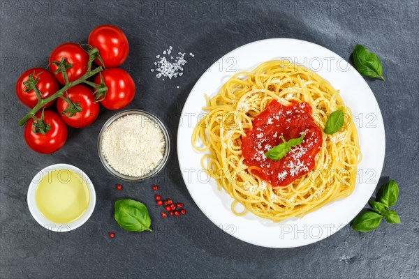 Spaghetti eat Italian pasta lunch dish with tomato sauce from top of slate in Stuttgart