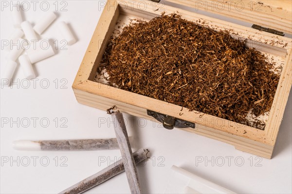 Wooden box with rolling tobacco