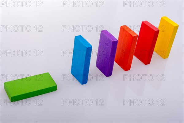 Colorful Domino Blocks in a line on a white background