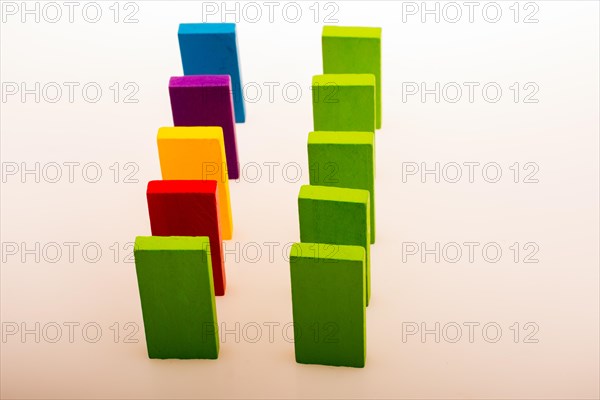 Colorful Domino Blocks in a line on a white background