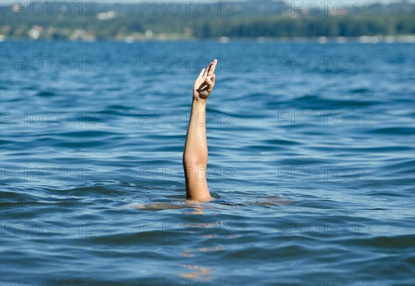 Woman in the Water and Showing the Thumb Up