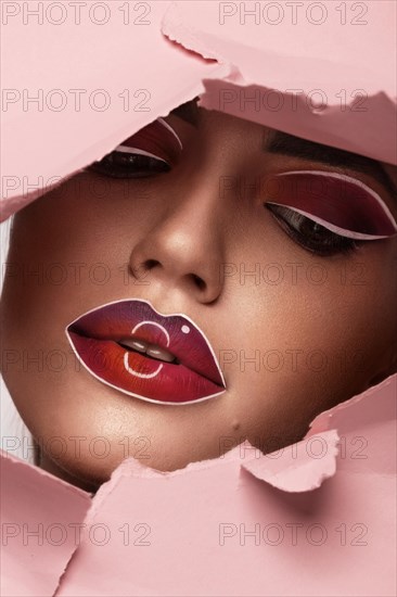 Beautiful woman with creative makeup and purple lips. Beauty face. Art makeup