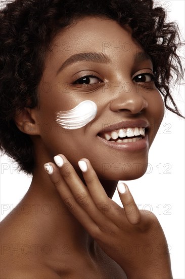 African American skincare models with perfect skin and curly hair. Beauty spa treatment concept