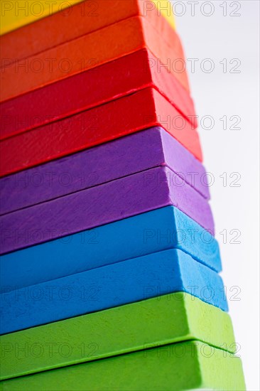 Colorful Domino Blocks in a line on a white background