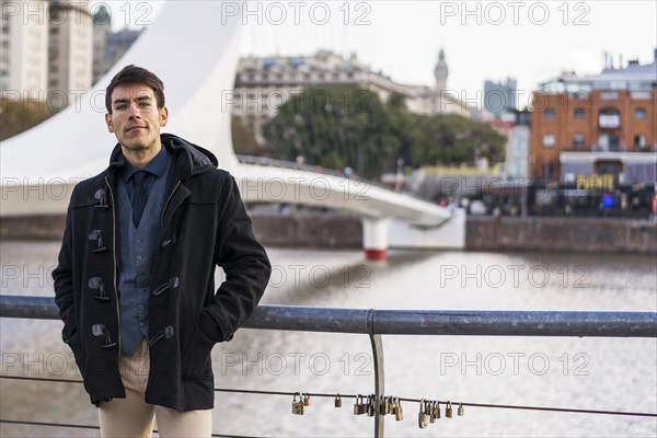 A man posing to camera near Puente de la Mujer