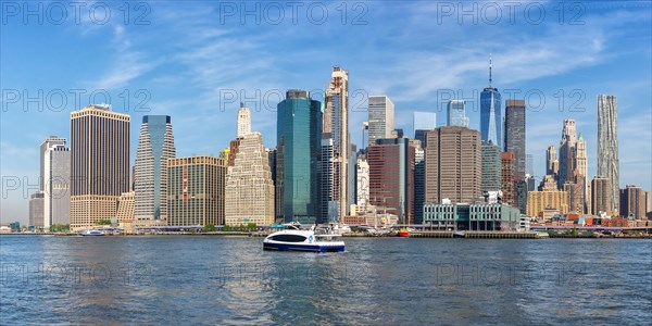 New York City Manhattan skyline with World Trade Center skyscraper and ferry panorama in New York