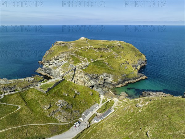 Aerial view of the rugged coastline on the Celtic Sea with the Tintagel Peninsula and the ruins of Tintagel Castle