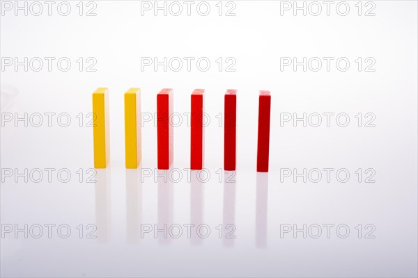 Colorful Domino Blocks in a line on a white background