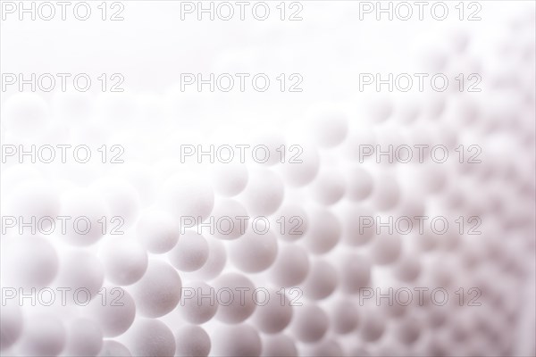 White little polystyrene foam balls as background