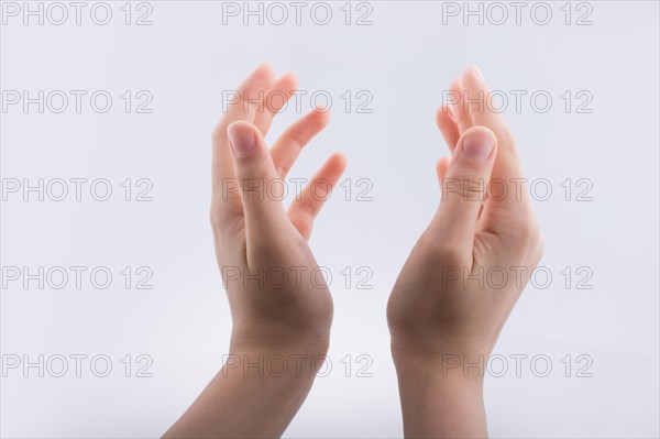 Hand holding gesture made on a white background
