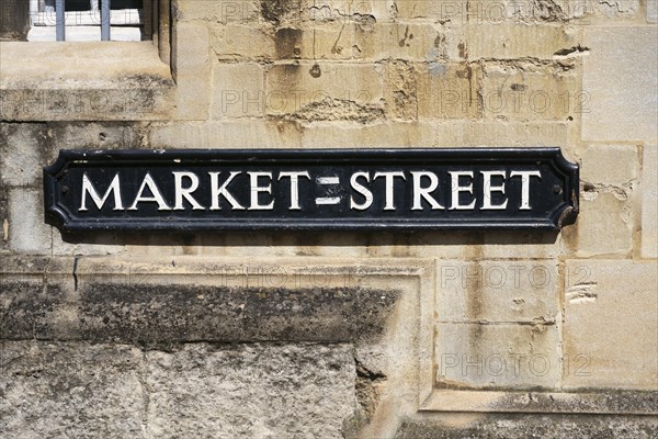 Old street sign on a house wall