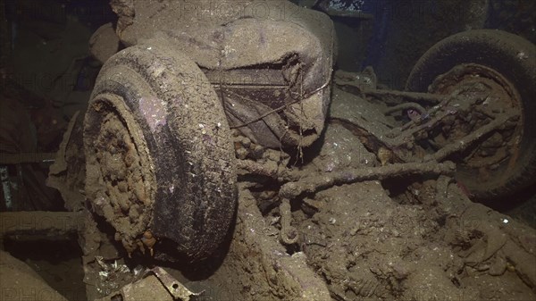 Overturned car and other cargo inside hold of ferry Salem Express shipwreck