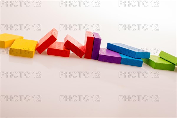 Colorful Domino Blocks in a line on a white background