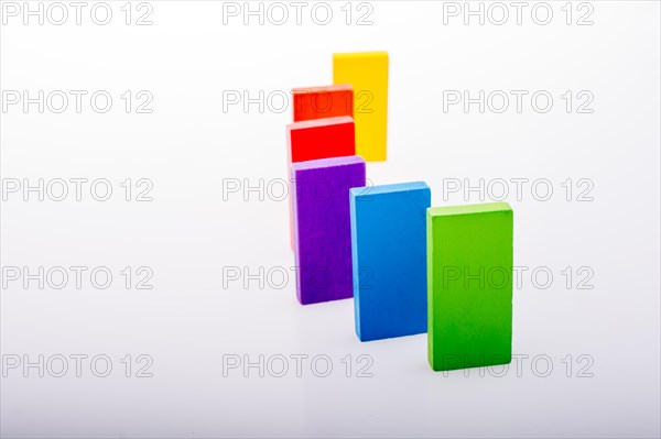 Colorful Domino Blocks in a line on a white background