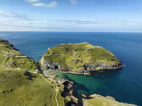 Aerial view of the rugged coastline on the Celtic Sea with the Tintagel Peninsula and the ruins of Tintagel Castle