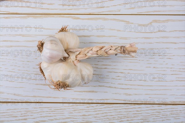 Cloves of garlic placed on a wooden texture