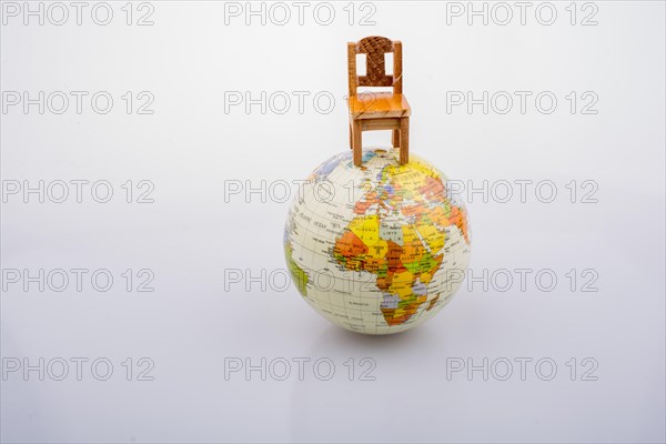 Chair is placed on the top of the model globe