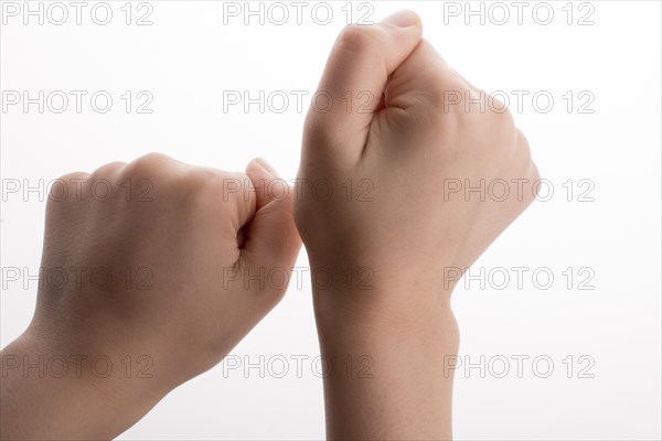 Clenched fists on a white background