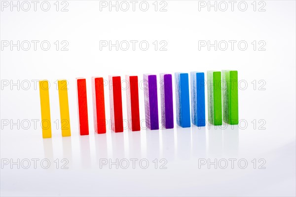 Colorful Domino Blocks in a line on a white background