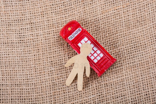 Paper man classical British style Red phone booth of London